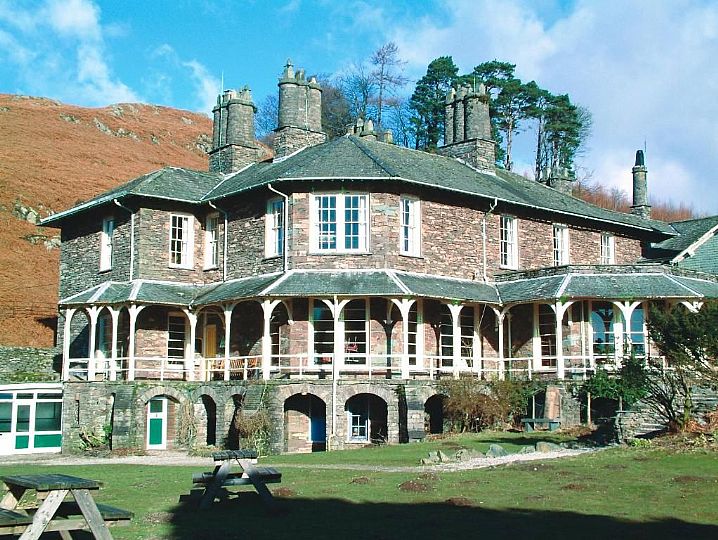 A view of High Close hostel showing the veranda and the hillside behind